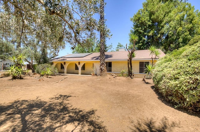 41151 Fig Grove Cir, Madera, CA 93636 - view of front of property with roof mounted solar panels and stucco siding