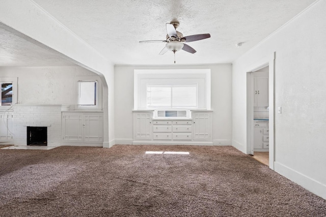 3334 E Montecito Ave, Fresno, CA 93702 - unfurnished living room with a textured ceiling, carpet flooring, ceiling fan, and a fireplace