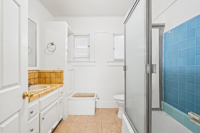 3334 E Montecito Ave, Fresno, CA 93702 - bathroom featuring vanity, tile patterned flooring, shower / bath combination with glass door, and crown molding