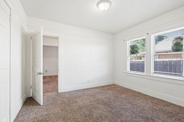 3334 E Montecito Ave, Fresno, CA 93702 - spare room with carpet flooring and baseboards