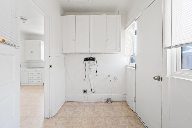 3334 E Montecito Ave, Fresno, CA 93702 - laundry room featuring cabinet space and washer hookup