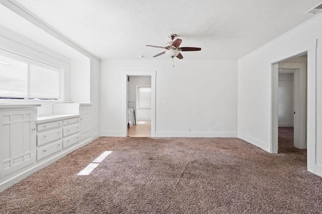 3334 E Montecito Ave, Fresno, CA 93702 - unfurnished bedroom with light carpet, a ceiling fan, and a textured ceiling