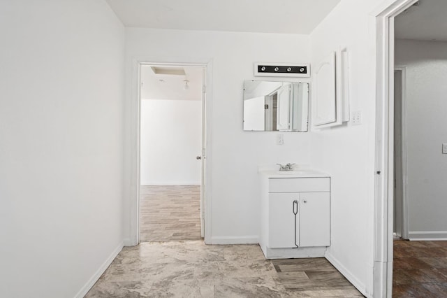 3334 E Montecito Ave, Fresno, CA 93702 - bathroom with vanity and baseboards
