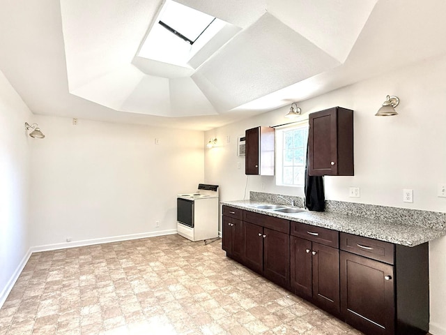 3334 E Montecito Ave, Fresno, CA 93702 - kitchen featuring white electric stove, a skylight, dark brown cabinetry, lofted ceiling, and light stone countertops