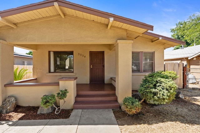 3334 E Montecito Ave, Fresno, CA 93702 - view of front of house with stucco siding and a gate