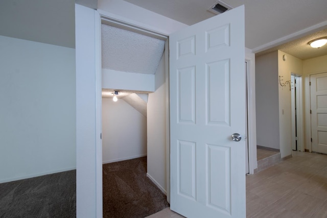 4875 N Backer Ave Unit 160, Fresno, CA 93726 - hallway featuring a textured ceiling and baseboards