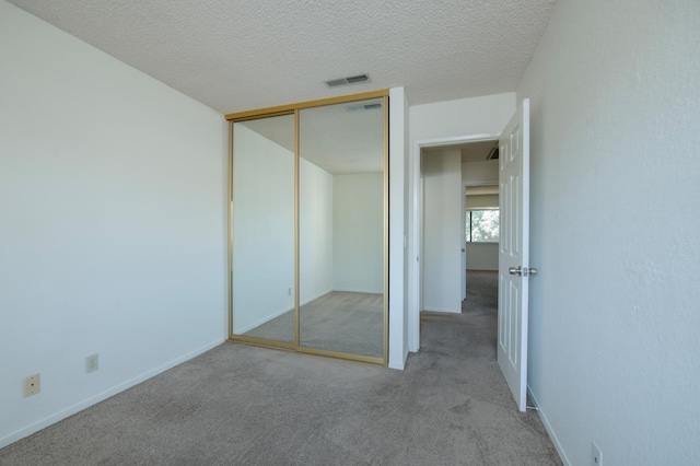 4875 N Backer Ave Unit 160, Fresno, CA 93726 - unfurnished bedroom with carpet, a closet, and a textured ceiling