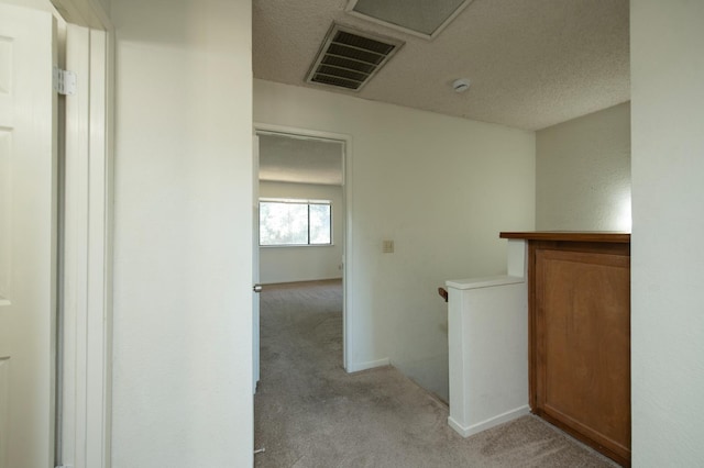 4875 N Backer Ave Unit 160, Fresno, CA 93726 - corridor featuring light carpet and an upstairs landing