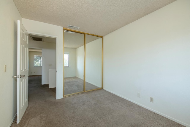 4875 N Backer Ave Unit 160, Fresno, CA 93726 - unfurnished bedroom featuring carpet, a closet, and a textured ceiling