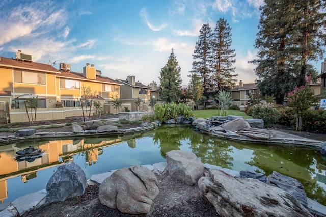 4875 N Backer Ave Unit 160, Fresno, CA 93726 - dock featuring a residential view and a garden pond