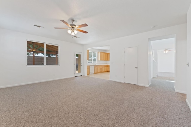 4220 Spruce St, Firebaugh, CA 93622 - unfurnished living room with ceiling fan and light colored carpet