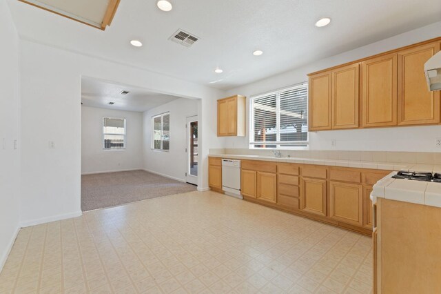 4220 Spruce St, Firebaugh, CA 93622 - kitchen featuring dishwasher, recessed lighting, tile countertops, open floor plan, and light colored carpet