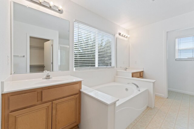 4220 Spruce St, Firebaugh, CA 93622 - full bathroom featuring vanity, tile patterned floors, a bath, and an enclosed shower