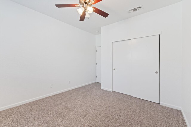 4220 Spruce St, Firebaugh, CA 93622 - unfurnished bedroom with light colored carpet, a closet, and ceiling fan