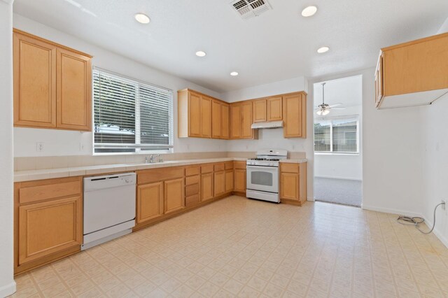 4220 Spruce St, Firebaugh, CA 93622 - kitchen with white appliances, under cabinet range hood, recessed lighting, and ceiling fan