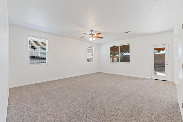 4220 Spruce St, Firebaugh, CA 93622 - spare room featuring a ceiling fan and light colored carpet