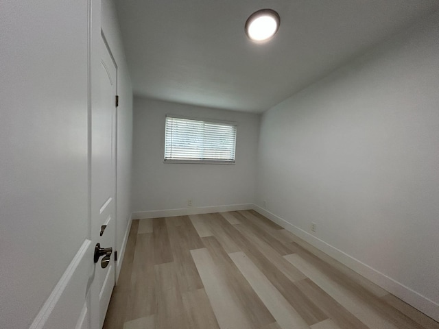 1223 E Drummond Ave, Fresno, CA 93706 - spare room featuring light wood-style floors and baseboards