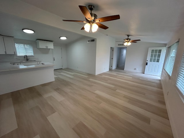 1223 E Drummond Ave, Fresno, CA 93706 - unfurnished living room with a ceiling fan, light wood finished floors, and lofted ceiling