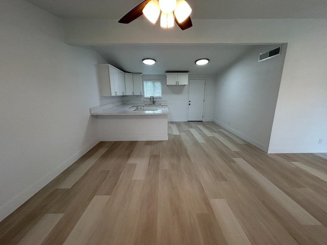 1223 E Drummond Ave, Fresno, CA 93706 - unfurnished living room featuring a ceiling fan and light wood-type flooring