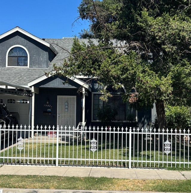 1592 N Ferger Ave, Fresno, CA 93728 - view of front of home with a fenced front yard and roof with shingles