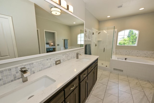 1082 E Oakmont, Fresno, CA 93730 - full bathroom featuring healthy amount of natural light, a shower stall, a bath, tasteful backsplash, and recessed lighting