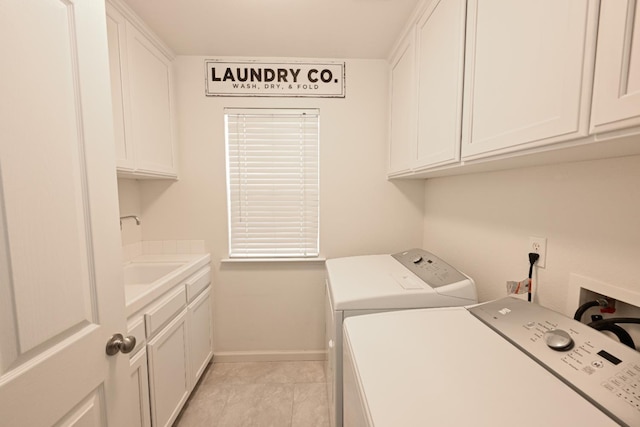 1082 E Oakmont, Fresno, CA 93730 - laundry room featuring washing machine and dryer, cabinet space, and light tile patterned floors