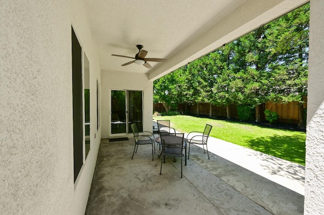 1082 E Oakmont, Fresno, CA 93730 - fenced backyard with ceiling fan, a patio area, and outdoor dining area