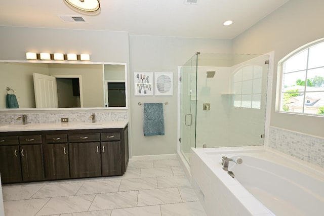 1082 E Oakmont, Fresno, CA 93730 - bathroom featuring a bath, a stall shower, double vanity, marble finish flooring, and recessed lighting
