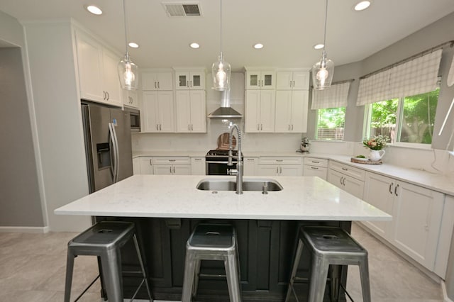 1082 E Oakmont, Fresno, CA 93730 - kitchen featuring recessed lighting, white cabinetry, glass insert cabinets, a breakfast bar, and light stone countertops