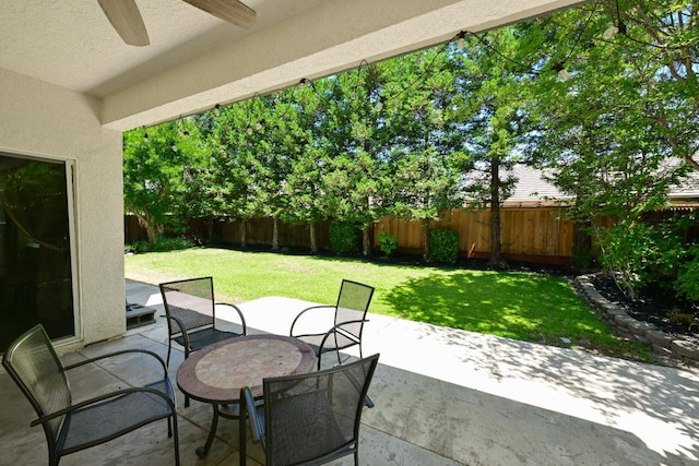 1082 E Oakmont, Fresno, CA 93730 - fenced backyard featuring a ceiling fan, a patio, and outdoor dining area
