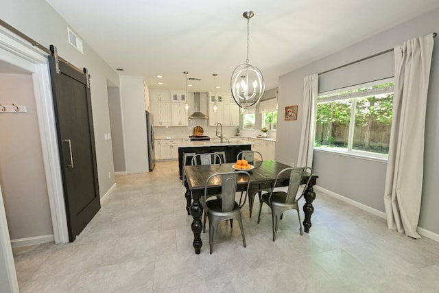1082 E Oakmont, Fresno, CA 93730 - dining area with a barn door and a chandelier