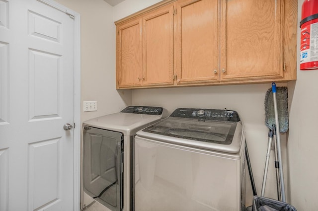 115 Prince Ln, Madera, CA 93637 - washroom with washer and clothes dryer and cabinet space