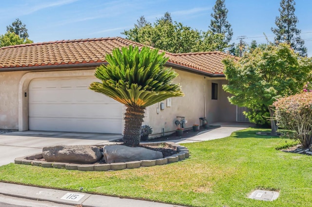 115 Prince Ln, Madera, CA 93637 - mediterranean / spanish home featuring stucco siding, a garage, a front yard, a tile roof, and concrete driveway
