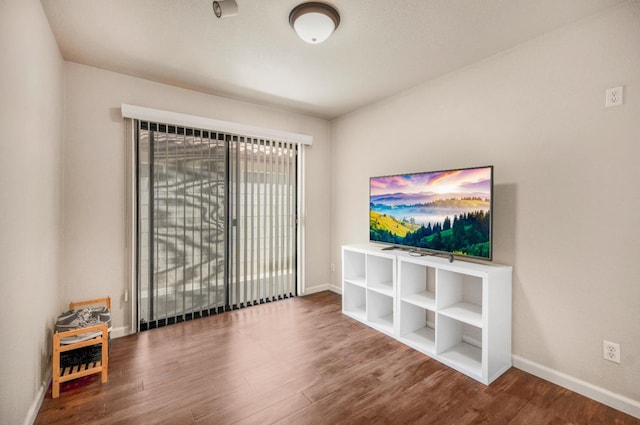 115 Prince Ln, Madera, CA 93637 - unfurnished living room featuring wood finished floors and baseboards