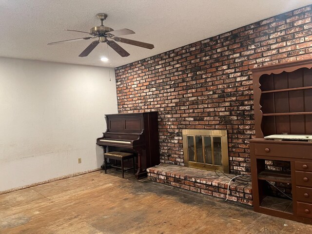 6924 N Winery, Fresno, CA 93710 - unfurnished room with ceiling fan, a fireplace, and a textured ceiling
