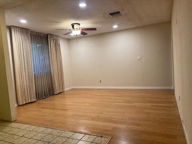 6924 N Winery, Fresno, CA 93710 - spare room featuring ceiling fan, light wood-style flooring, a textured ceiling, and recessed lighting