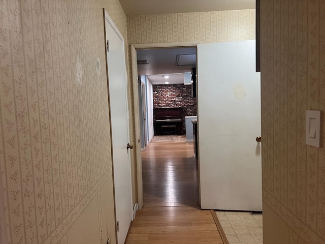 6924 N Winery, Fresno, CA 93710 - corridor with wallpapered walls and light wood finished floors