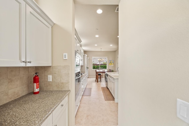 10911 E Swift Ave, Clovis, CA 93619 - kitchen with tasteful backsplash, recessed lighting, stainless steel appliances, light tile patterned flooring, and white cabinetry