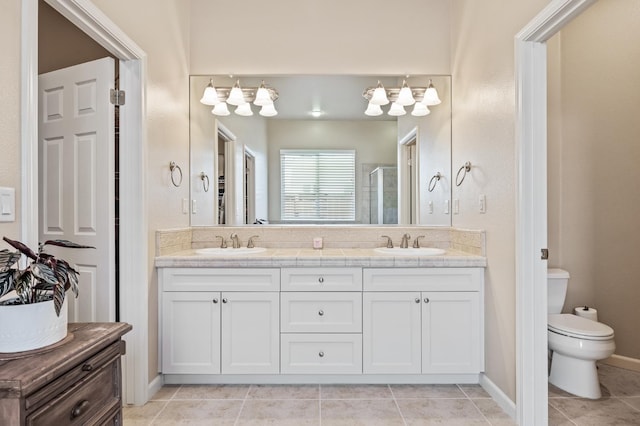 10911 E Swift Ave, Clovis, CA 93619 - bathroom featuring double vanity, tile patterned floors, a shower stall, and a chandelier
