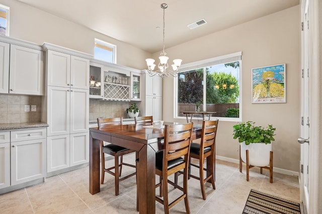 10911 E Swift Ave, Clovis, CA 93619 - dining room with a chandelier and light tile patterned floors