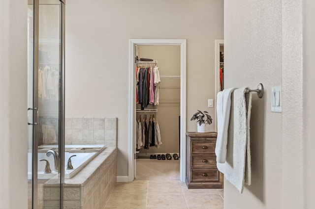 10911 E Swift Ave, Clovis, CA 93619 - full bathroom with a bath, tile patterned flooring, a spacious closet, and a shower with door