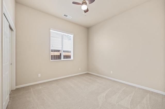 10911 E Swift Ave, Clovis, CA 93619 - unfurnished bedroom featuring light carpet, a closet, and a ceiling fan
