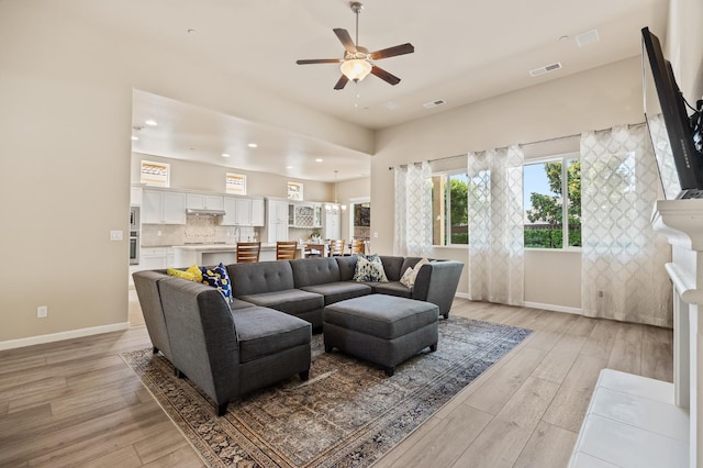 10911 E Swift Ave, Clovis, CA 93619 - living area with a ceiling fan, light wood finished floors, and recessed lighting