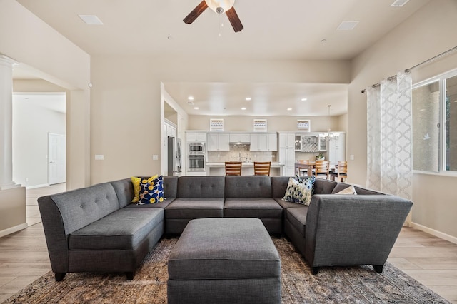 10911 E Swift Ave, Clovis, CA 93619 - living room featuring ornate columns, wood finished floors, a ceiling fan, and recessed lighting