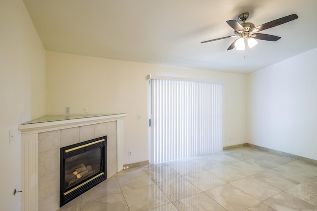 1542 E Alluvial Ave Unit 128, Fresno, CA 93720 - unfurnished living room featuring a tiled fireplace, a ceiling fan, and light tile patterned flooring