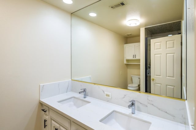 1542 E Alluvial Ave Unit 128, Fresno, CA 93720 - bathroom featuring toilet and double vanity