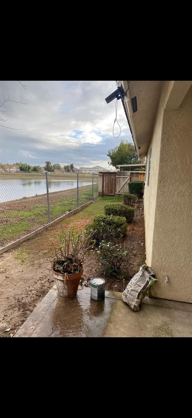1542 E Alluvial Ave Unit 128, Fresno, CA 93720 - view of yard with a water view