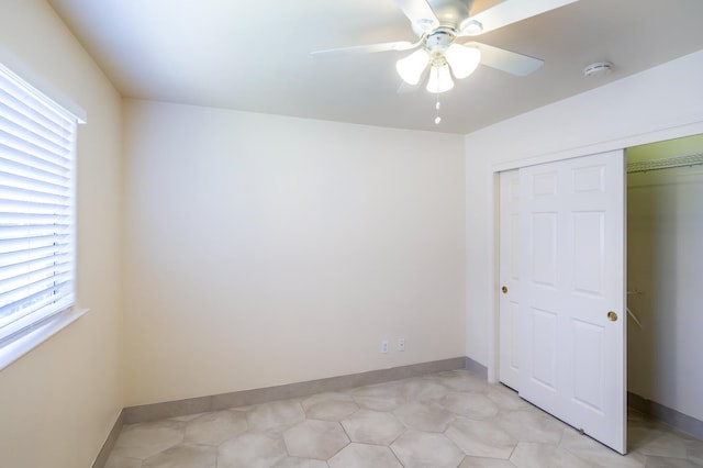 1542 E Alluvial Ave Unit 128, Fresno, CA 93720 - unfurnished bedroom with a closet, multiple windows, and a ceiling fan