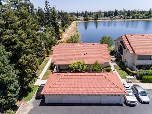 1542 E Alluvial Ave Unit 128, Fresno, CA 93720 - aerial view of property and surrounding area with a nearby body of water and a tree filled landscape