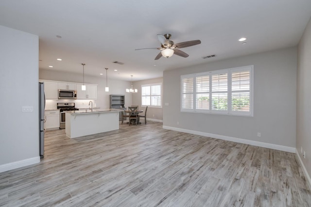 629 Del Monte Ave, Clovis, CA 93619 - living room featuring recessed lighting, ceiling fan, and light wood finished floors